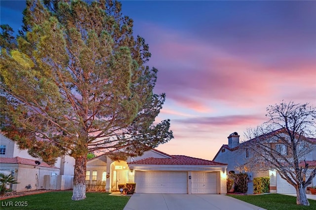 7405 Blue Sage Ct, Las Vegas, NV 89129 - view of front of home with driveway, a garage, stucco siding, and a tile roof