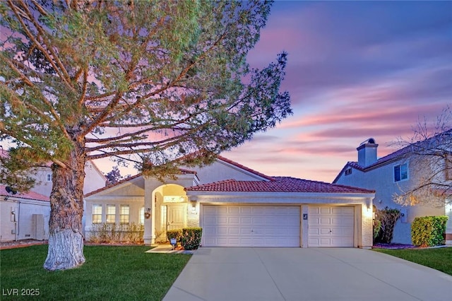 7405 Blue Sage Ct, Las Vegas, NV 89129 - mediterranean / spanish-style house with driveway, a garage, a front lawn, stucco siding, and a tile roof
