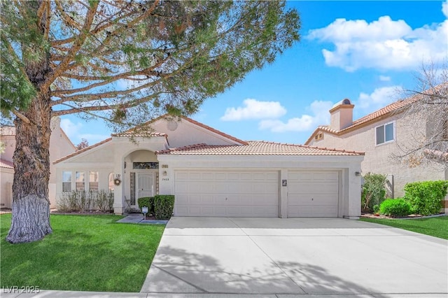 7405 Blue Sage Ct, Las Vegas, NV 89129 - mediterranean / spanish-style home featuring a garage, concrete driveway, stucco siding, a tile roof, and a front yard