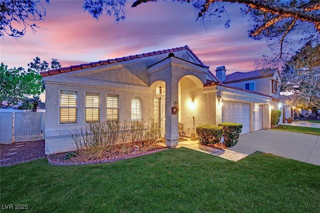 7405 Blue Sage Ct, Las Vegas, NV 89129 - mediterranean / spanish home featuring concrete driveway, a garage, and stucco siding