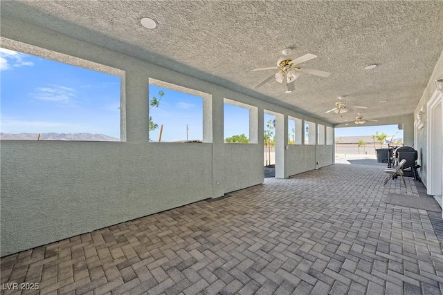 view of patio with ceiling fan