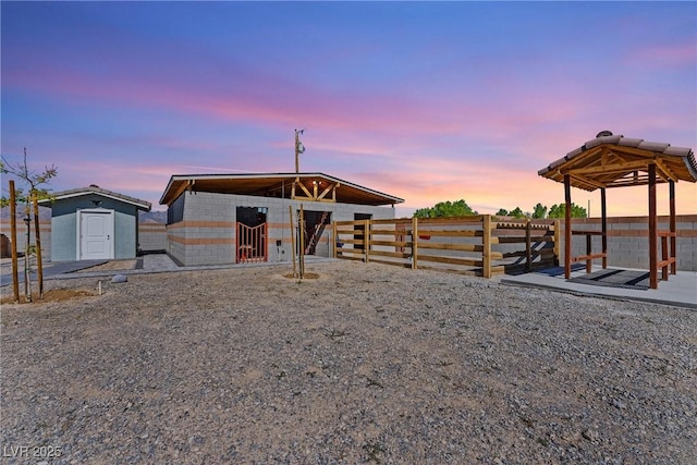 view of front of house with an exterior structure and an outbuilding