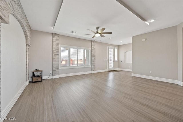 unfurnished living room featuring light wood-style floors, a ceiling fan, baseboards, recessed lighting, and visible vents