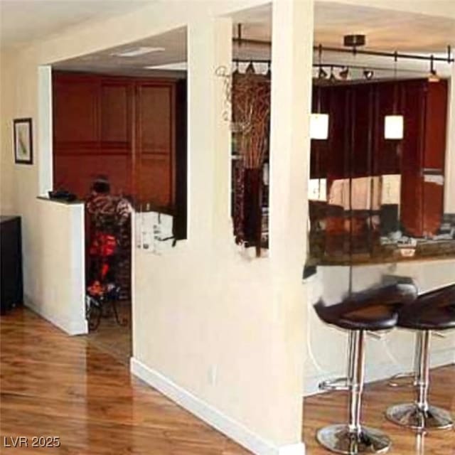 2569 Malabar Ave, Las Vegas, NV 89121 - hallway with wood finished floors and baseboards
