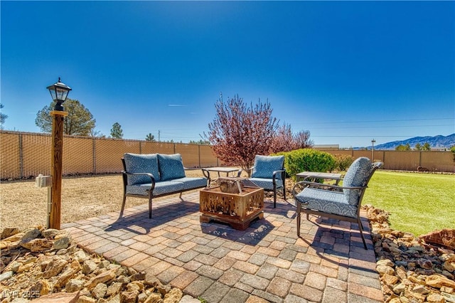 view of patio with outdoor lounge area and fence
