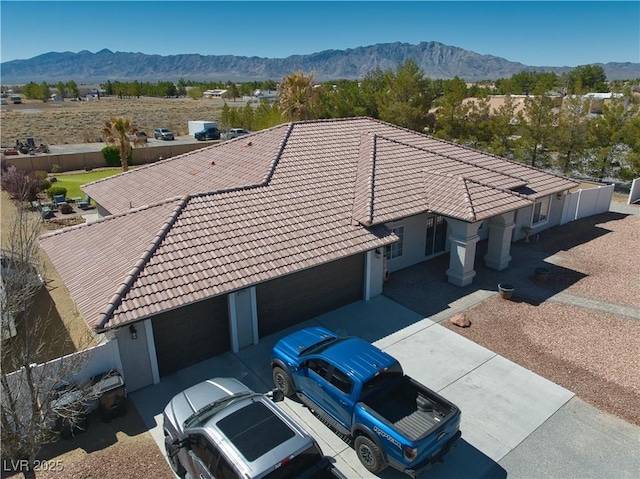 birds eye view of property with a mountain view