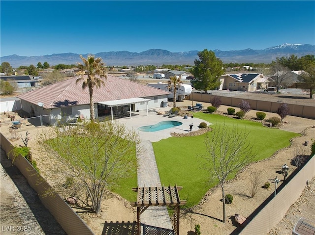 1131 China St, Pahrump, NV 89048 - fenced backyard with a mountain view, a patio, and a residential view