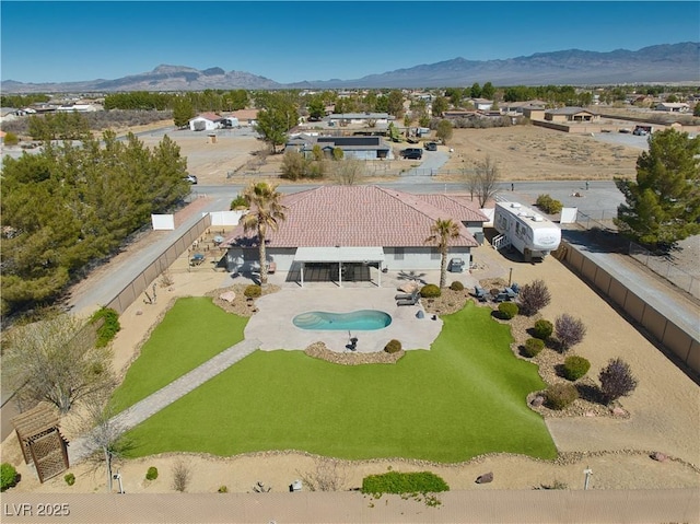1131 China St, Pahrump, NV 89048 - aerial view of property and surrounding area with a pool area and a mountain backdrop