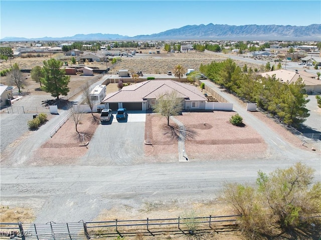 birds eye view of property featuring a mountain view