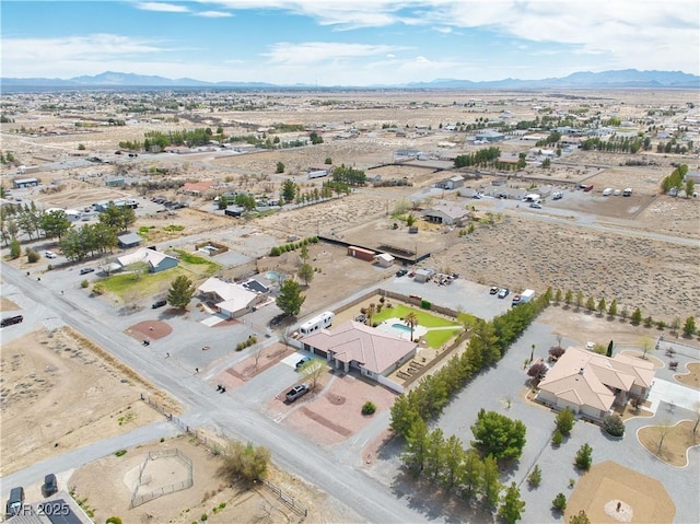 aerial view featuring view of desert and a mountain view