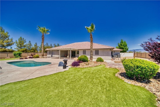 1131 China St, Pahrump, NV 89048 - rear view of property with a patio, stucco siding, and a tiled roof