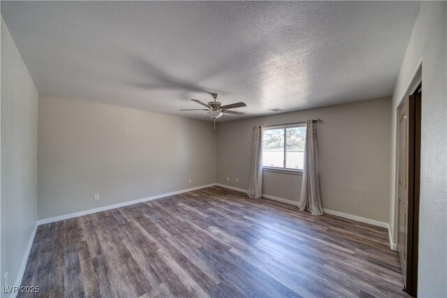 1131 China St, Pahrump, NV 89048 - empty room featuring ceiling fan, wood finished floors, a textured ceiling, and baseboards