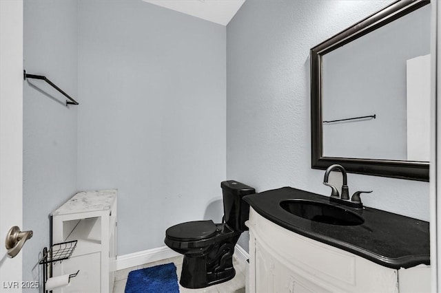 3920 Sweet Pine St Unit 102, Las Vegas, NV 89108 - bathroom featuring toilet, vanity, baseboards, and tile patterned flooring