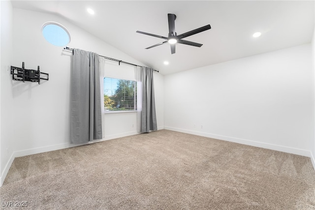 carpeted spare room featuring recessed lighting, baseboards, vaulted ceiling, and ceiling fan