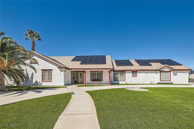 8515 Belcastro St, Las Vegas, NV 89113 - ranch-style house with a front yard, roof mounted solar panels, and stucco siding
