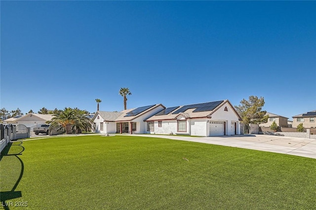 8515 Belcastro St, Las Vegas, NV 89113 - ranch-style home with roof mounted solar panels, a residential view, concrete driveway, and a garage