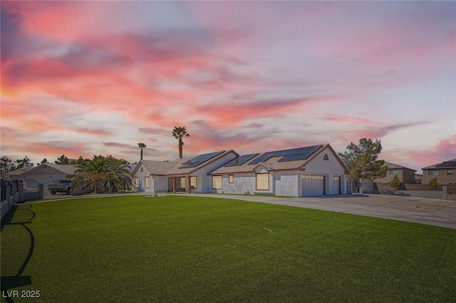 8515 Belcastro St, Las Vegas, NV 89113 - view of front of house with solar panels, concrete driveway, a garage, and a residential view