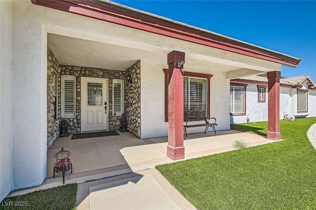 8515 Belcastro St, Las Vegas, NV 89113 - entrance to property featuring stone siding, a yard, a porch, and stucco siding