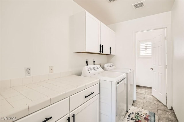 8515 Belcastro St, Las Vegas, NV 89113 - laundry area with cabinet space and washing machine and clothes dryer