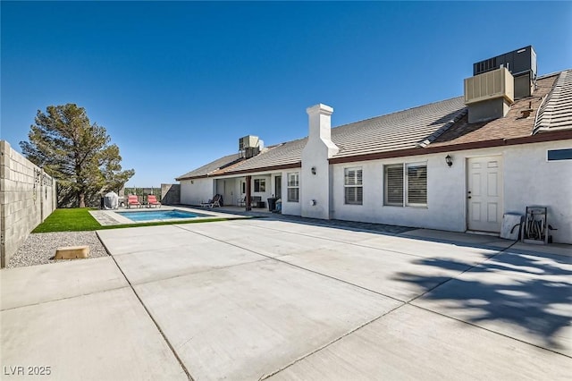 8515 Belcastro St, Las Vegas, NV 89113 - rear view of house featuring a fenced backyard, stucco siding, a patio area, and a tile roof