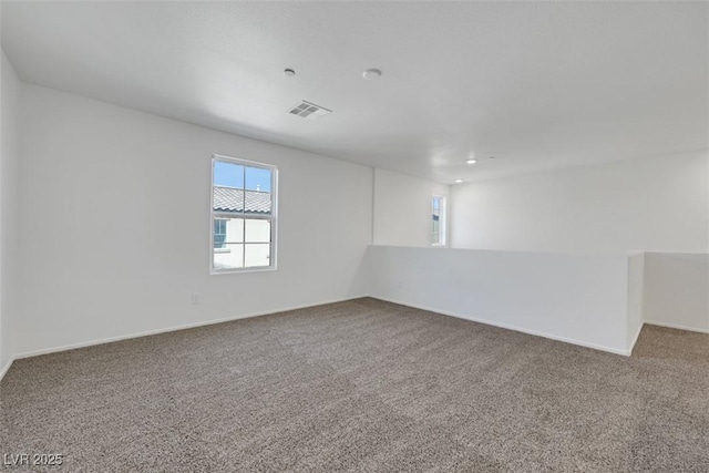 spare room with carpet floors and baseboards