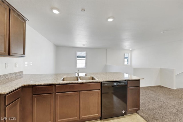kitchen with dishwasher, a sink, a peninsula, open floor plan, and recessed lighting