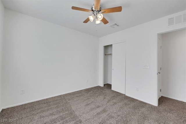 unfurnished bedroom with carpet flooring, a closet, a ceiling fan, and baseboards