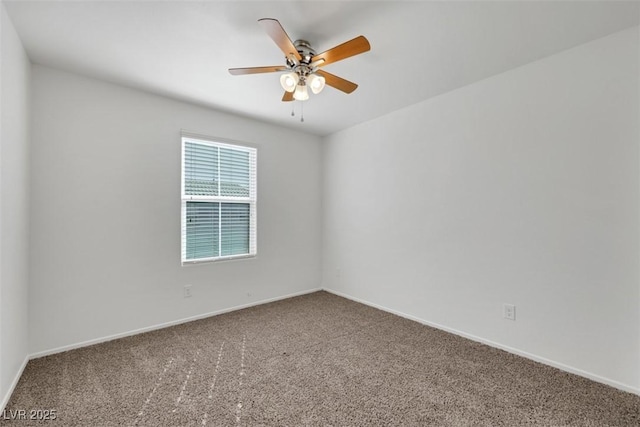 unfurnished room featuring carpet floors, ceiling fan, and baseboards