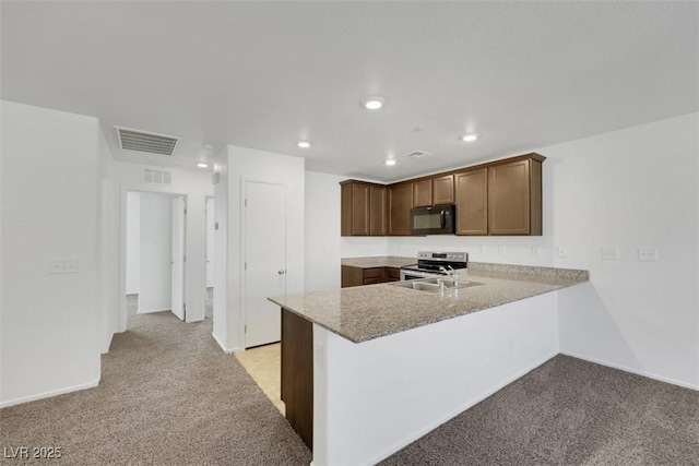 kitchen with black microwave, stainless steel electric stove, light carpet, a peninsula, and recessed lighting