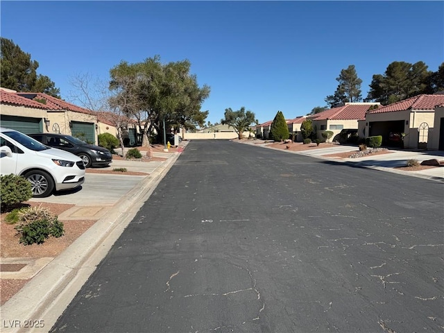 2796 Cape Hope Way, Las Vegas, NV 89121 - view of asphalt street featuring curbs, a residential view, and sidewalks