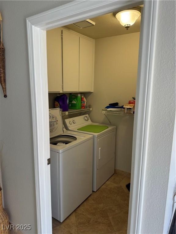 2796 Cape Hope Way, Las Vegas, NV 89121 - clothes washing area featuring washer and clothes dryer and cabinet space