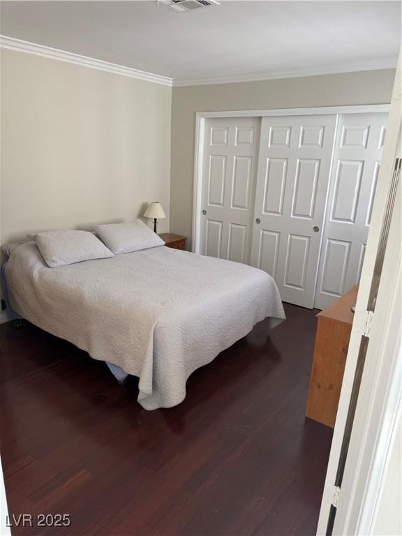 2796 Cape Hope Way, Las Vegas, NV 89121 - bedroom with dark wood finished floors, crown molding, and a closet