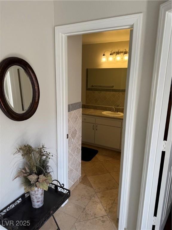 2796 Cape Hope Way, Las Vegas, NV 89121 - bathroom with tile patterned flooring, vanity, and tile walls