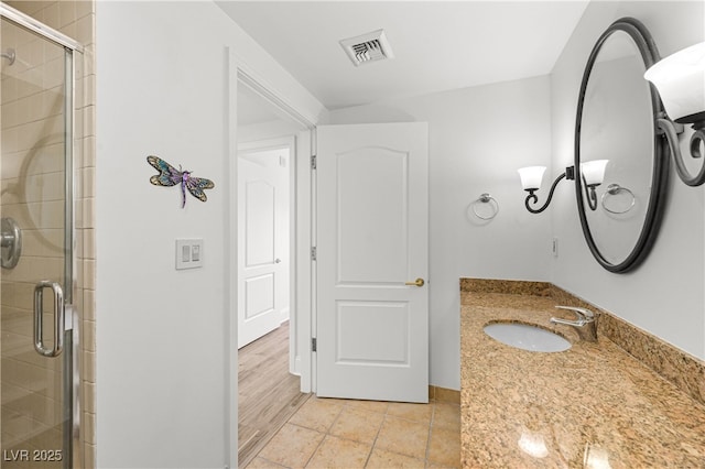 30 Strada Di Villaggio 409, Henderson, NV 89011 - bathroom featuring tile patterned floors, vanity, a stall shower, and visible vents