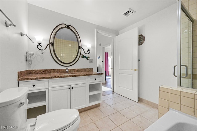 30 Strada Di Villaggio 409, Henderson, NV 89011 - bathroom with tile patterned floors, toilet, vanity, baseboards, and visible vents