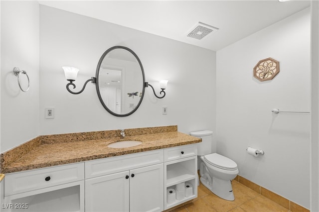30 Strada Di Villaggio 409, Henderson, NV 89011 - bathroom with visible vents, baseboards, toilet, tile patterned floors, and vanity