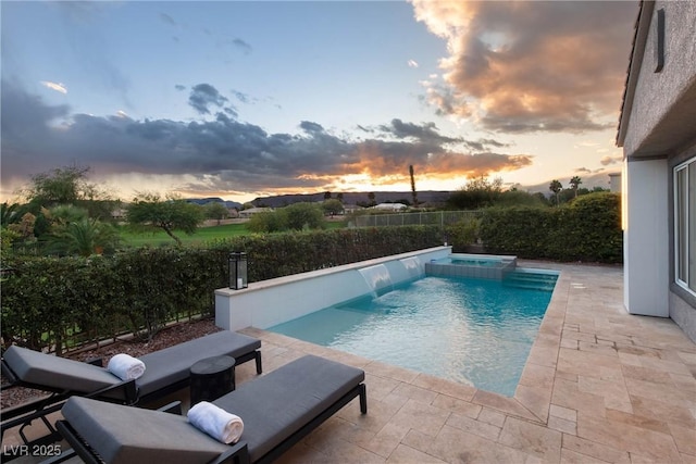 view of swimming pool featuring a fenced in pool, a patio, an in ground hot tub, and a fenced backyard