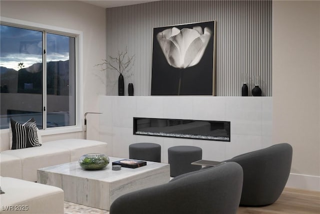 living room with baseboards and wood finished floors
