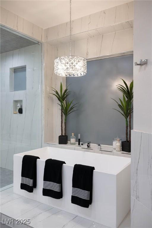 full bathroom featuring a marble finish shower and marble finish floor