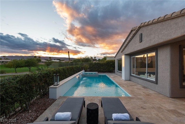 view of pool featuring a patio, a fenced in pool, and a fenced backyard