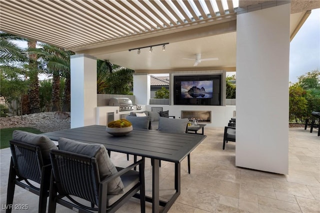view of patio / terrace with ceiling fan, grilling area, area for grilling, outdoor dining area, and an outdoor fireplace