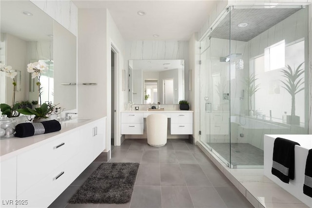 full bathroom with vanity, heating unit, tile patterned floors, and a shower stall