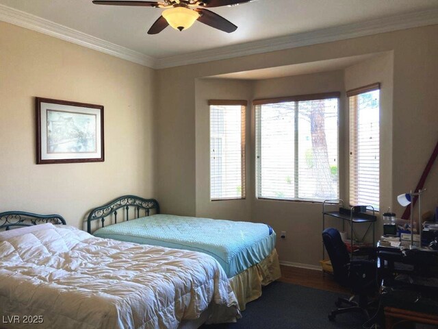 bedroom featuring ceiling fan, baseboards, ornamental molding, and wood finished floors
