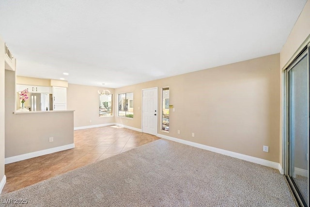3123 Key Largo Dr Unit 101, Las Vegas, NV 89120 - unfurnished living room featuring light tile patterned flooring, baseboards, light carpet, and recessed lighting