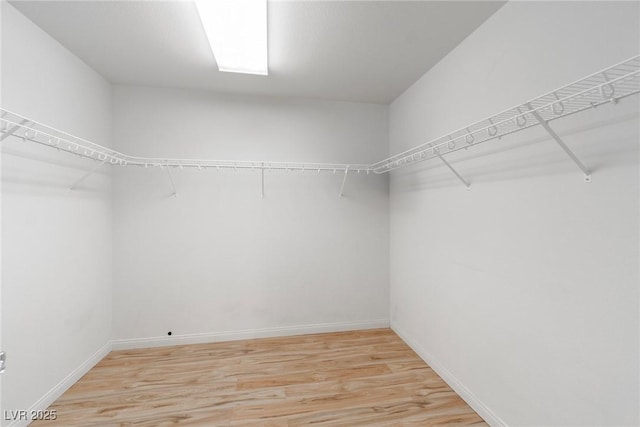 walk in closet featuring light wood-type flooring