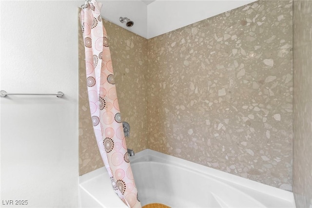bathroom featuring shower / bath combo with shower curtain and wallpapered walls