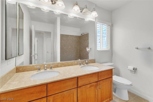 bathroom featuring toilet, a shower, tile patterned flooring, double vanity, and baseboards