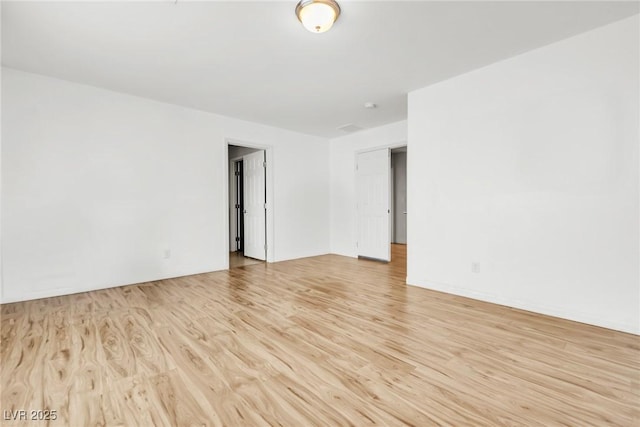 unfurnished room featuring light wood-type flooring