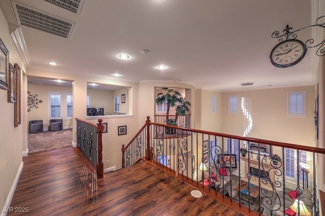 8429 Brackenfield Ave, Las Vegas, NV 89178 - hallway with ornamental molding, an upstairs landing, wood finished floors, recessed lighting, and baseboards