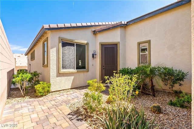 2612 Tullamore Creek Ln, Laughlin, NV 89029 - view of exterior entry with stucco siding and a patio area